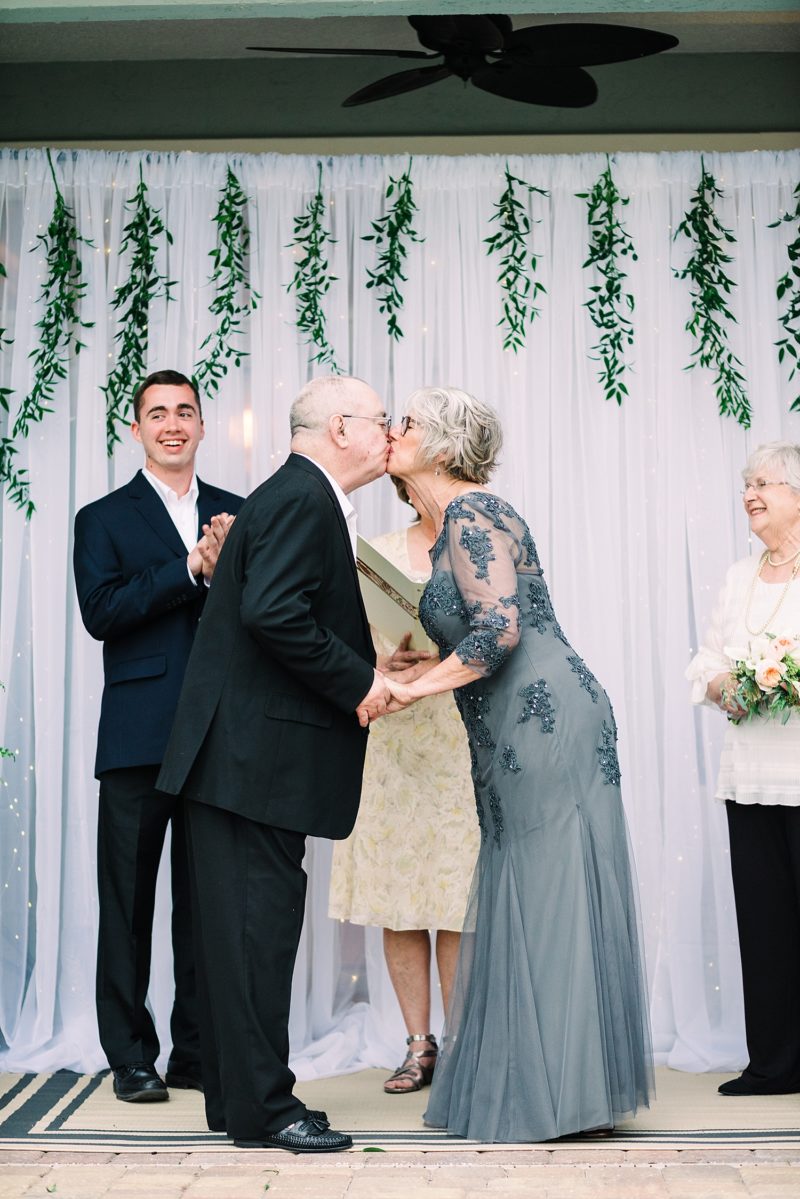 bride and groom’s first kiss