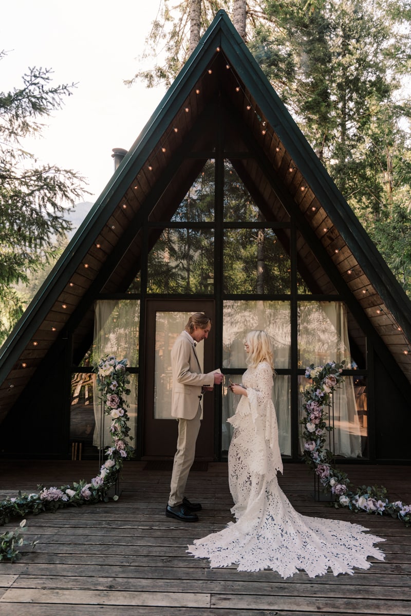 elopement ceremony in front of packwood a-frame cabin