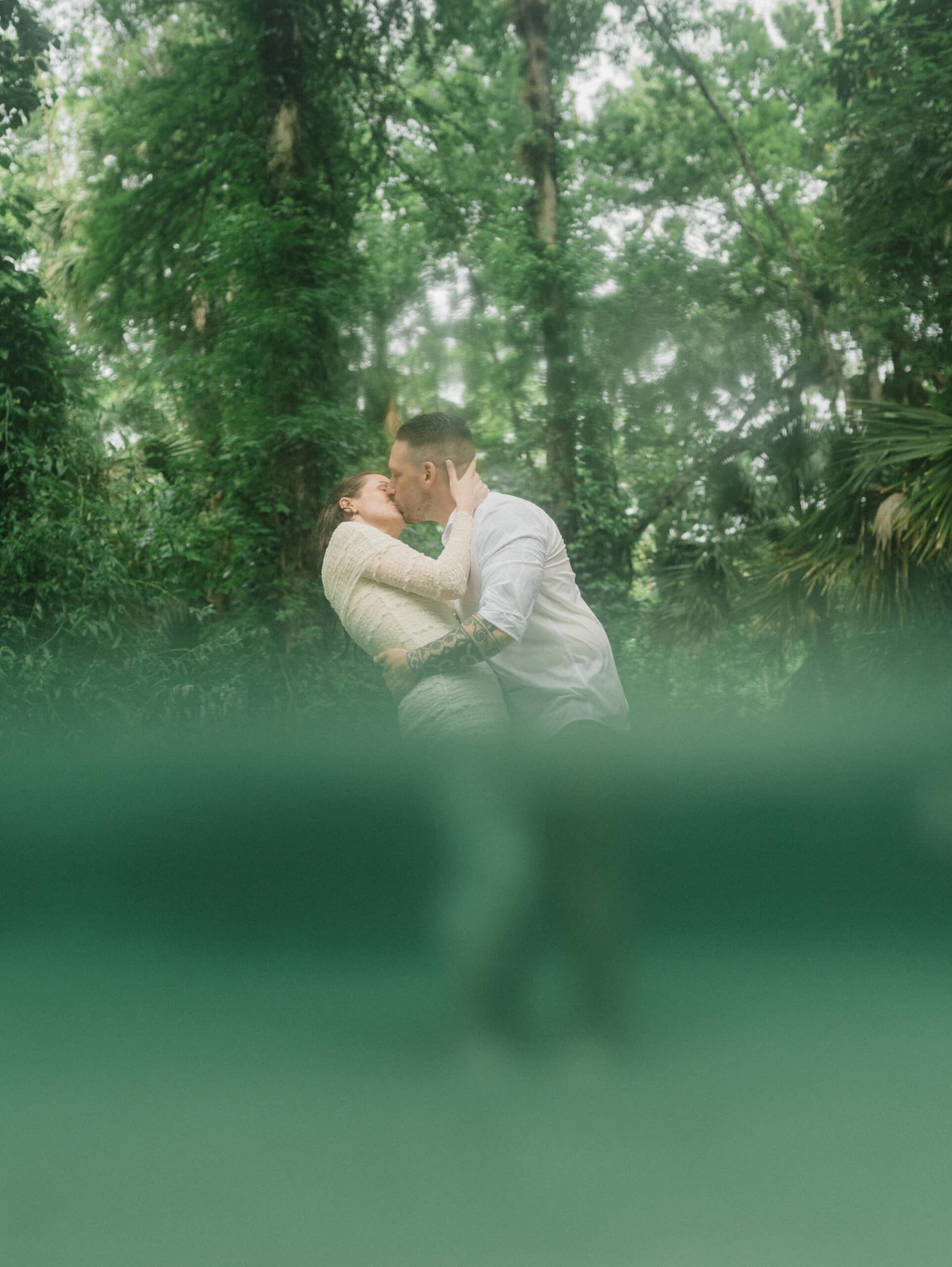 elopement couple standing in water during their Florida Springs Elopement at Kelly Park