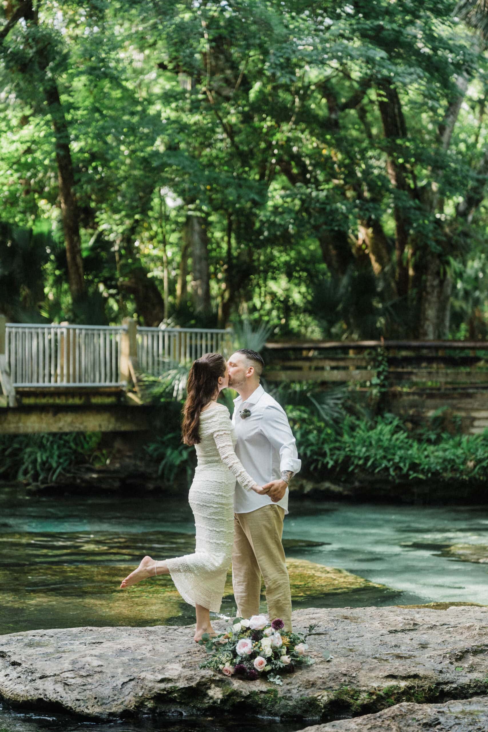 playful elopement couple kissing during their florida springs elopement