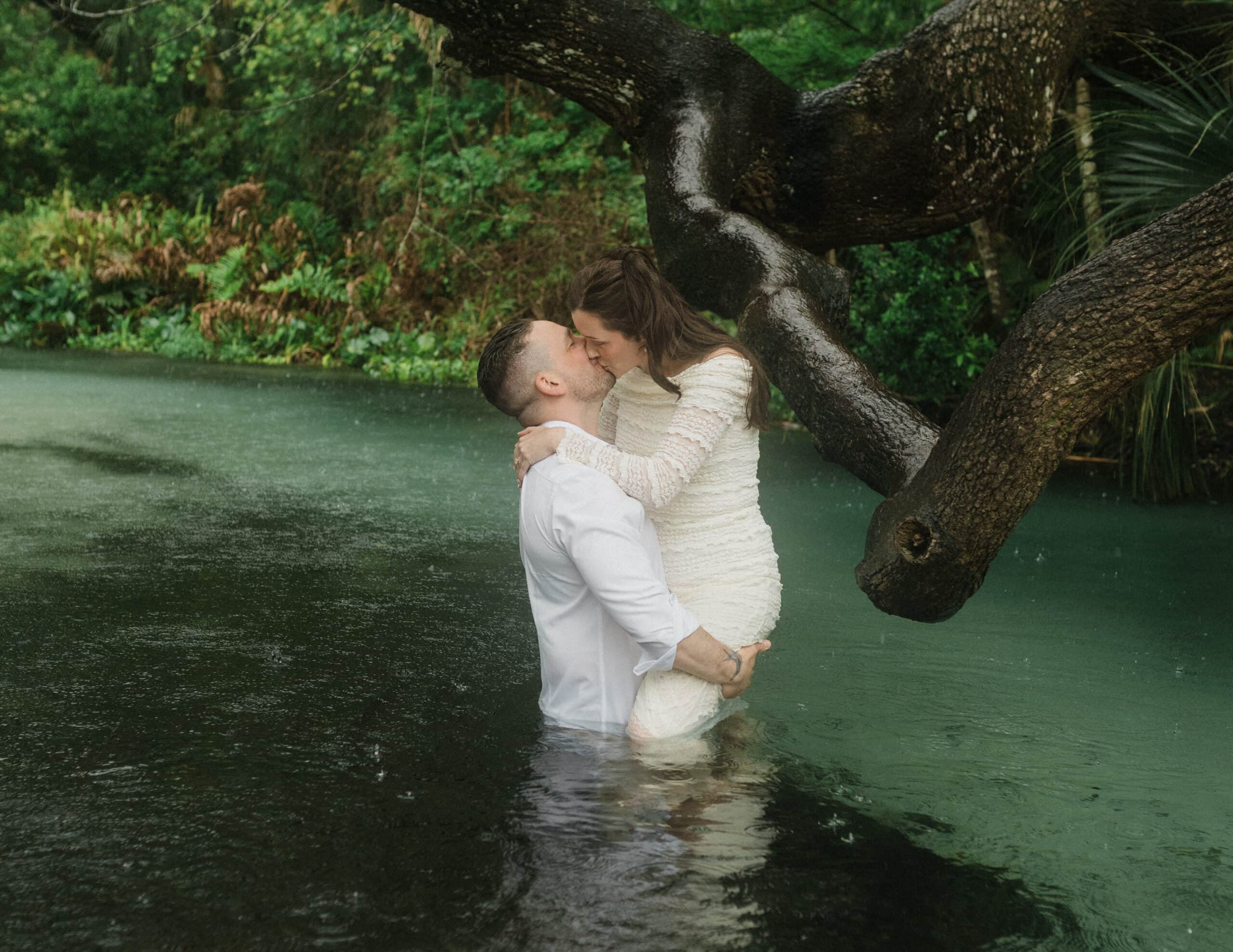 elopement couple standing in water during their Florida Springs Elopement at Kelly Park