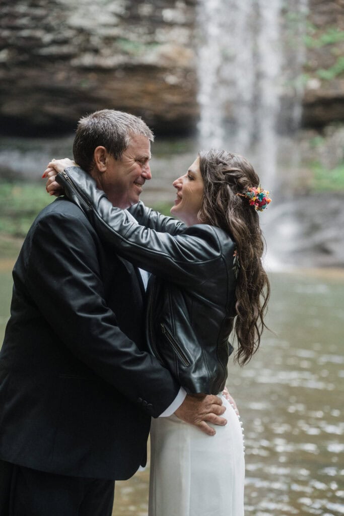 elopement couple snuggling at a waterfall during a cloudland canyon elopement