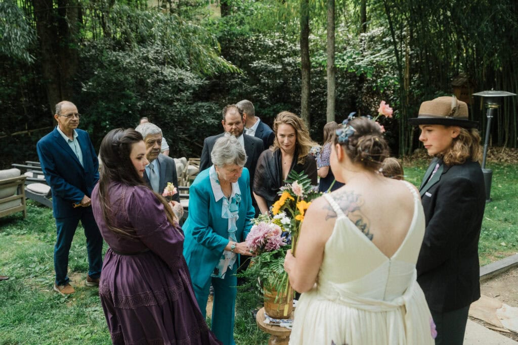 guests helping assemble a wedding bouquet