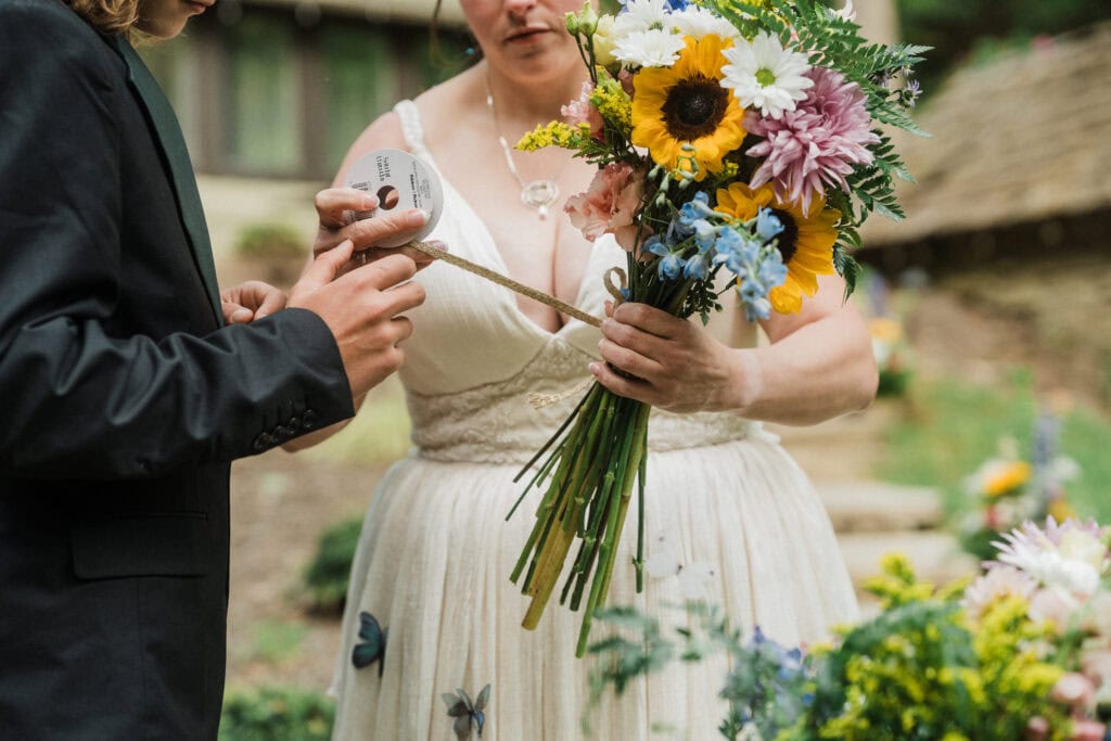 guests helping assemble a wedding bouquet