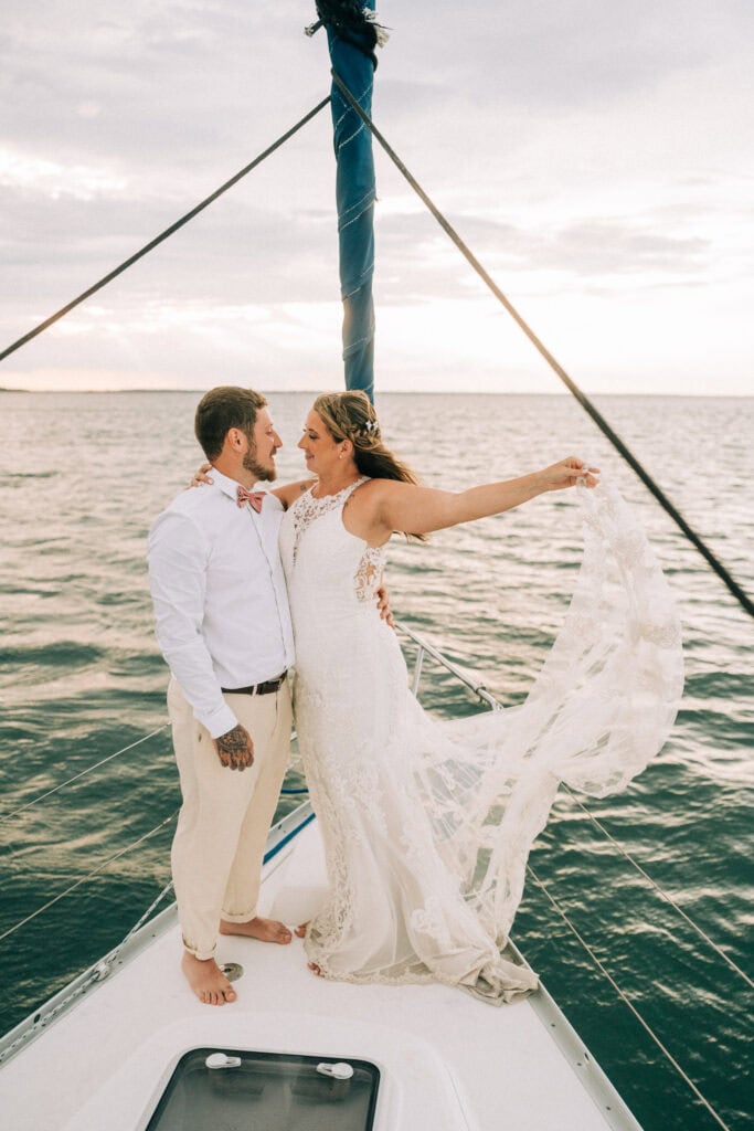 elopement couple on a sailboat during their florida sailboat elopement day