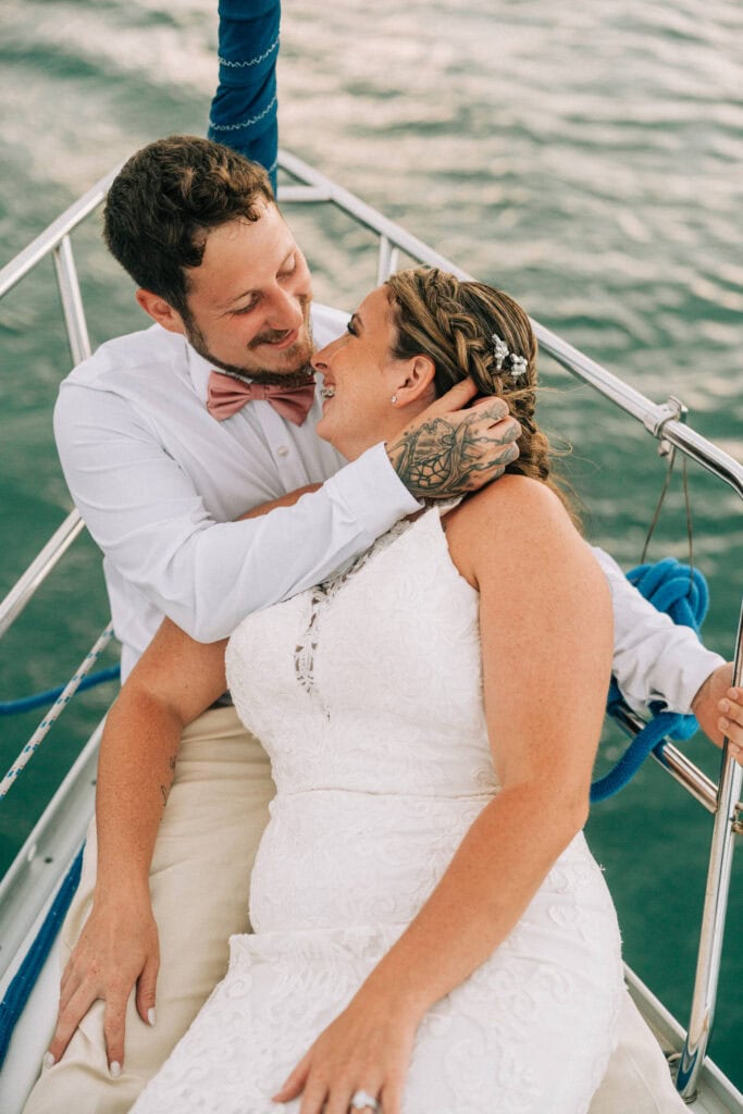 elopement couple on a sailboat during their florida sailboat elopement day