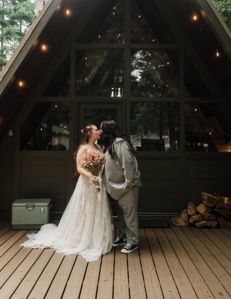 elopement couple first look outside their a frame cabin in mt rainier national park