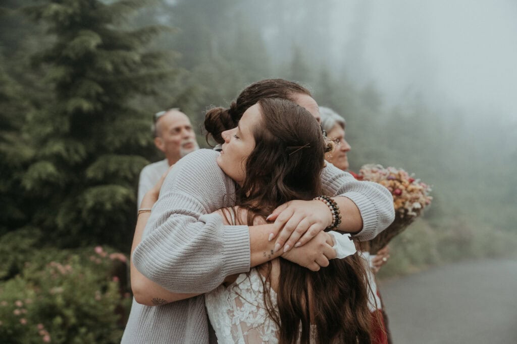 elopement couple hugging loved ones after ceremony
