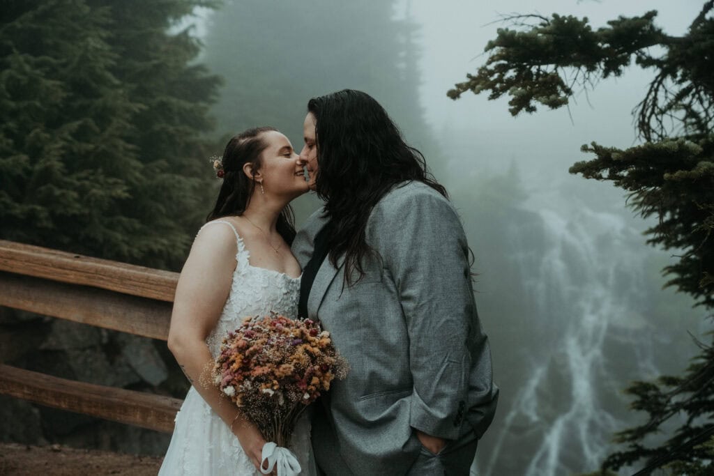 elopement couple wandering around the landscapes of mt rainier national park