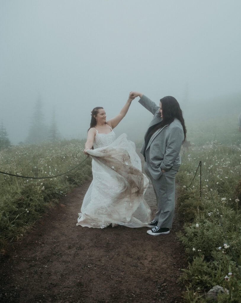 elopement couple dancing in a wildflower field during their mt rainier wildflower elopement