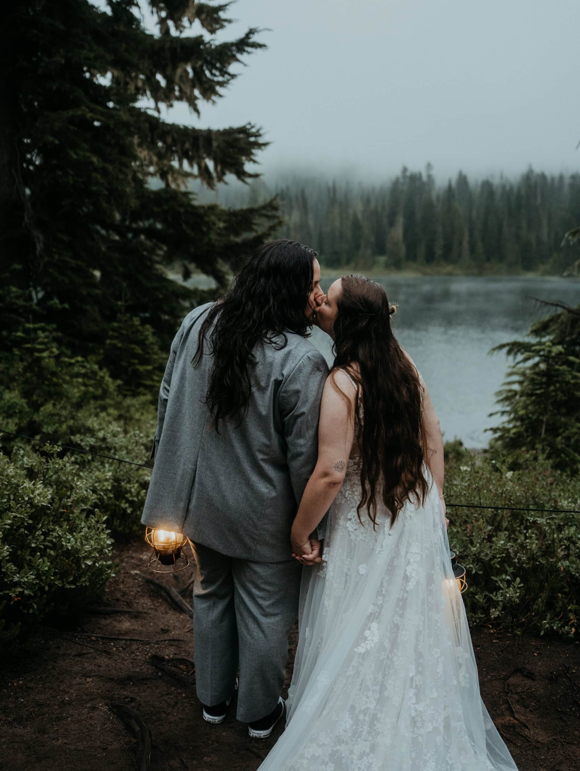 elopement couple holding lanterns during their mt rainier national park elopement