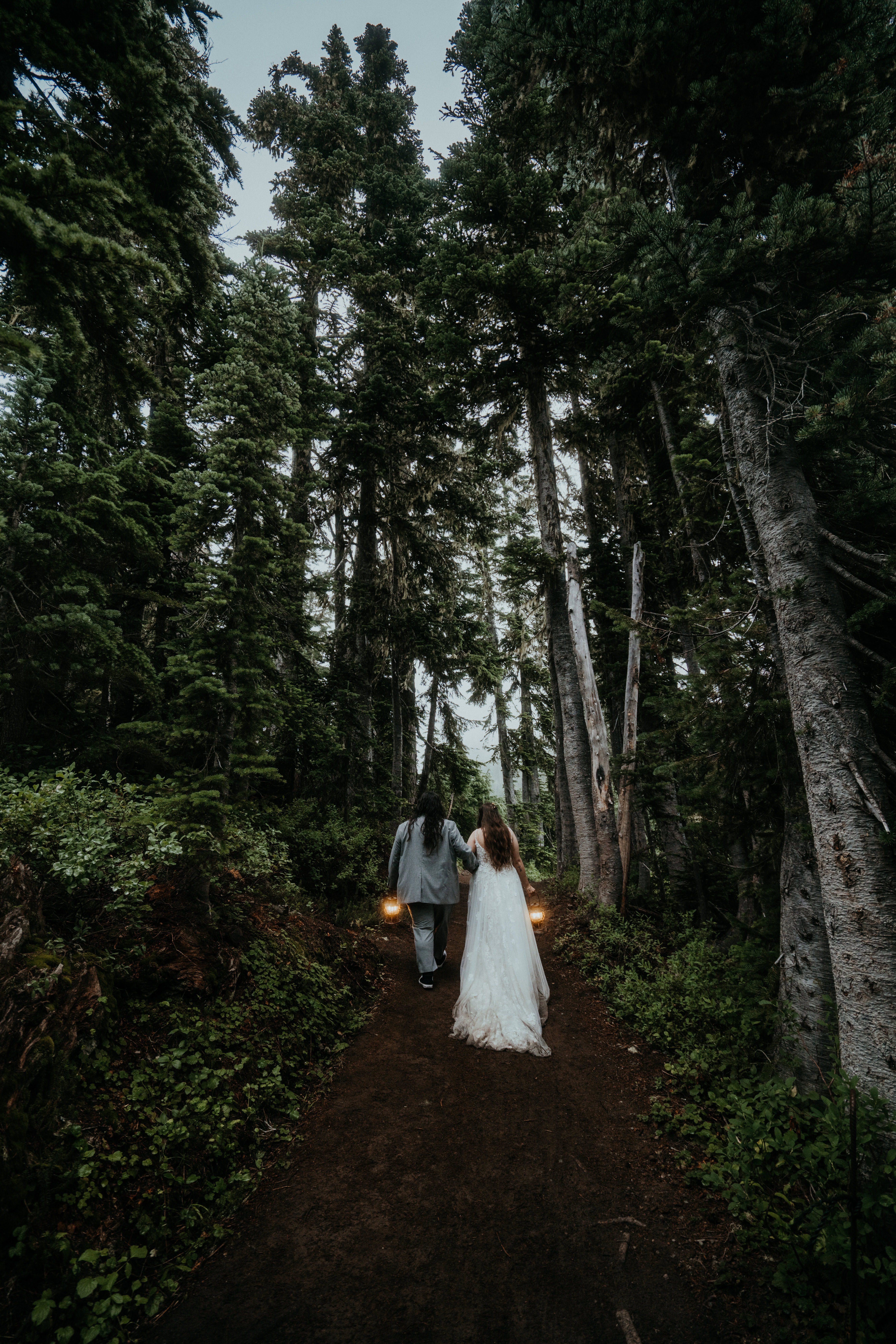 elopement couple holding lanterns during their mt rainier national park elopement